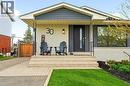 White brick facade with dark gray siding accents - 30 Darlington Drive, Hamilton, ON  - Outdoor With Deck Patio Veranda 
