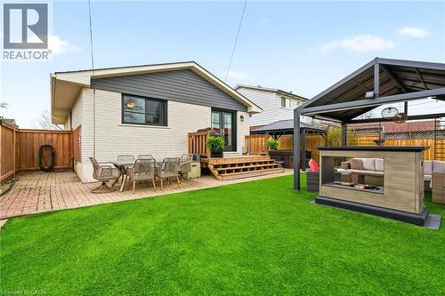 Expansive green lawn with a defined brick paver patio - 30 Darlington Drive, Hamilton, ON - Outdoor With Deck Patio Veranda With Exterior