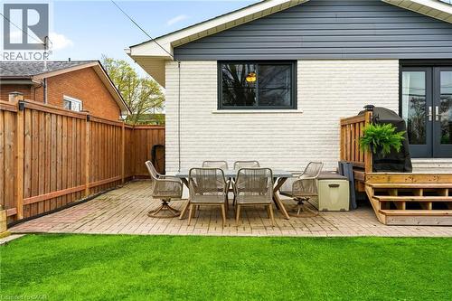 Patio area featuring brick pavers and a wooden privacy fence - 30 Darlington Drive, Hamilton, ON - Outdoor With Deck Patio Veranda With Exterior
