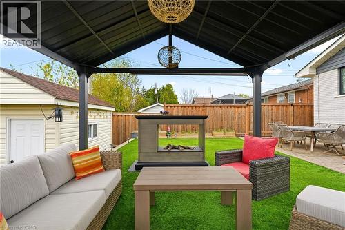 Covered patio featuring a dark metal gazebo structure and integrated lighting - 30 Darlington Drive, Hamilton, ON - Outdoor With Deck Patio Veranda With Exterior