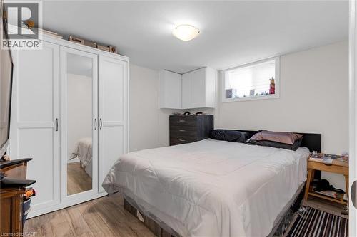 Wood-finish flooring throughout - 406 East 43Rd Street, Hamilton, ON - Indoor Photo Showing Bedroom