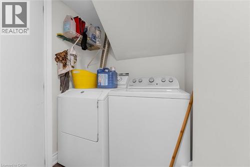 Dedicated laundry area featuring a white washing machine and a white dryer - 406 East 43Rd Street, Hamilton, ON - Indoor Photo Showing Laundry Room