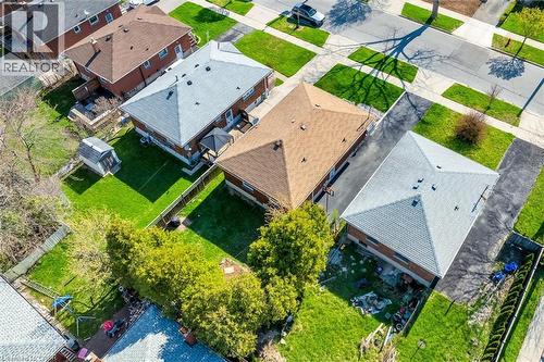 Aerial view showcasing multiple residential properties, each featuring a pitched roof - 406 East 43Rd Street, Hamilton, ON - Outdoor With View