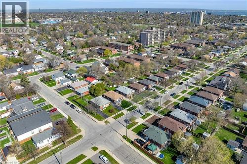 Aerial perspective of a residential neighborhood featuring established single-family homes with pitched roofs and green lawns - 406 East 43Rd Street, Hamilton, ON - Outdoor With View
