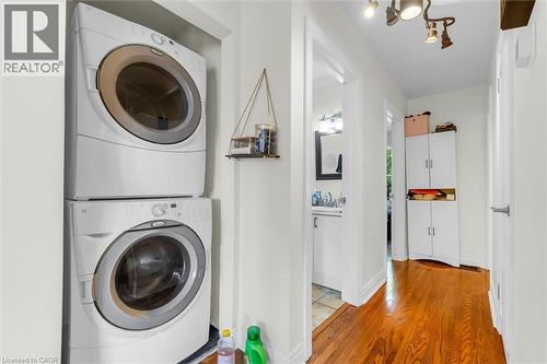 Dedicated laundry area featuring a stacked washer and dryer - 406 East 43Rd Street, Hamilton, ON - Indoor Photo Showing Laundry Room