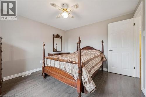 Room featuring wood-finish flooring, neutral wall tones, and white baseboards - 42 Trailview Drive, Kitchener, ON - Indoor Photo Showing Bedroom