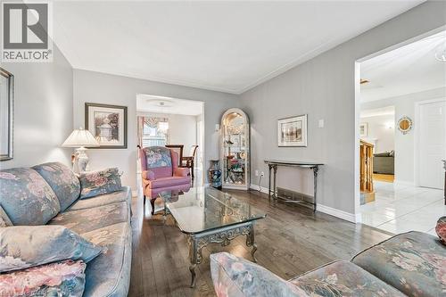 Living area featuring wood-finish flooring, light gray wall paint, and white baseboards - 42 Trailview Drive, Kitchener, ON - Indoor Photo Showing Living Room