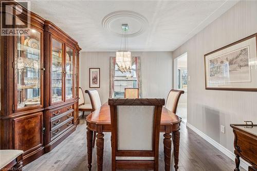 Recessed ceiling with a decorative medallion and a multi-tiered chandelier - 42 Trailview Drive, Kitchener, ON - Indoor Photo Showing Dining Room