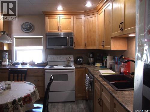561 Dome Crescent, Burstall, SK - Indoor Photo Showing Kitchen With Double Sink