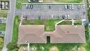 Parking lot - exclusive number parking spaces and visitor parking - 60 Donly Drive S Unit# 101, Simcoe, ON  -  