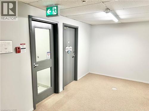 Outside the unit door is the staircase to the lobby - 60 Donly Drive S Unit# 101, Simcoe, ON - Indoor