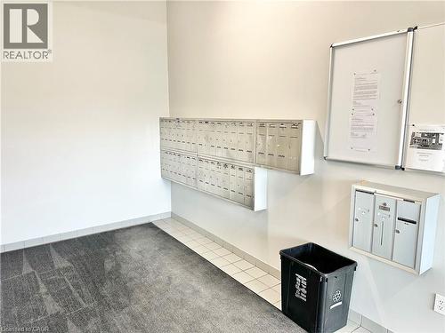 Lobby - mail boxes in the building - 60 Donly Drive S Unit# 101, Simcoe, ON - Indoor Photo Showing Other Room