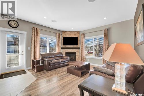 102 Atton Crescent, Saskatoon, SK - Indoor Photo Showing Living Room With Fireplace