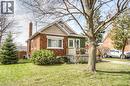 Brick and stucco exterior with a prominent front porch and a gabled roofline - 46 2 Avenue, Kitchener, ON  - Outdoor 
