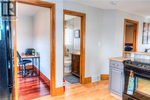 Light wood-finish flooring extending into a dedicated nook featuring a rich wood-finish floor - 46 2 Avenue, Kitchener, ON - Indoor Photo Showing Kitchen