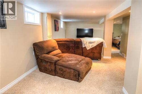 Carpeted recreation area with recessed lighting, painted walls, and white baseboards - 46 2 Avenue, Kitchener, ON - Indoor