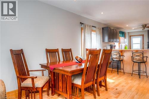 Dining area featuring wood-finish flooring, recessed lighting, and a window with natural wood trim - 46 2 Avenue, Kitchener, ON - Indoor Photo Showing Dining Room