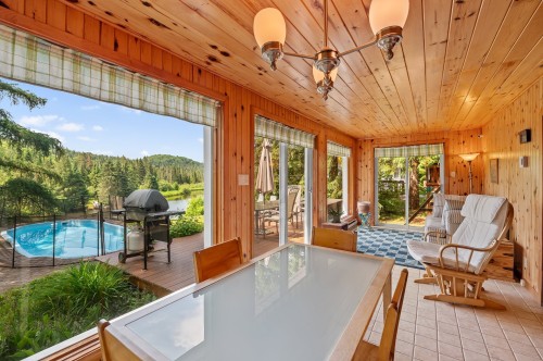 Véranda - 3102 Ch. Des Lacs, Mont-Blanc, QC -  Photo Showing Other Room With In Ground Pool