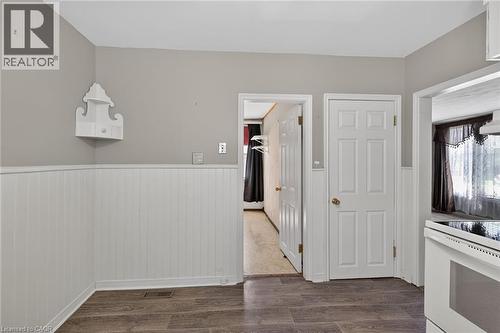 Wood-finish flooring paired with white beadboard wainscoting and light gray wall paint - 192 Ivon Avenue, Hamilton, ON - Indoor