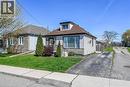 Front exterior featuring horizontal siding, a dormer window, and a shingled roof - 192 Ivon Avenue, Hamilton, ON  - Outdoor 