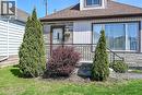 Exterior facade featuring stone veneer and vertical siding accents - 192 Ivon Avenue, Hamilton, ON  - Outdoor 