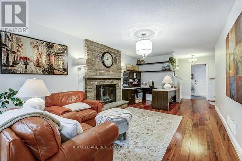 Cherry Hardwood floors - 1279 Old English Lane, Oakville, ON - Indoor Photo Showing Living Room With Fireplace