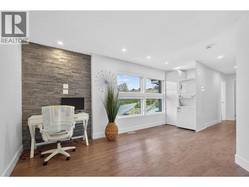 Family Room Upstairs With Stackable Laundry (Another full laundry room on main floor) - 3859 Carrall Road, West Kelowna, BC 