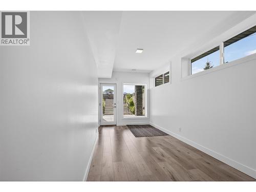 Separate basement entrance with a versatile flex room, ideal for converting into an in-law suite. - 3859 Carrall Road, West Kelowna, BC 