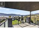 Multiple outdoor spaces to entertain, including two balconies and a patio, all with lake views. - 3859 Carrall Road, West Kelowna, BC 