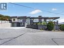 Plenty of parking with room for 6 vehicles in the driveway and 2 in the garage, plus an additional lower spot for an RV or trailer. - 3859 Carrall Road, West Kelowna, BC 