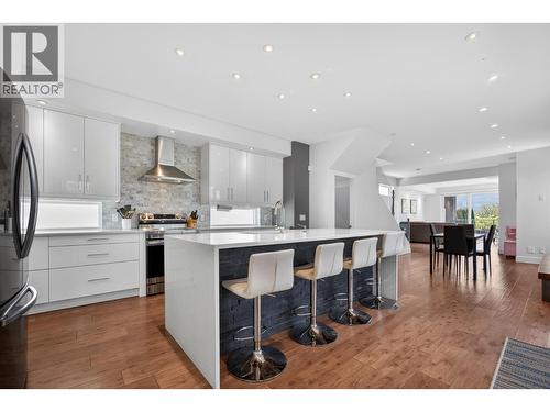Entertainers kitchen with 4 stool island - 3859 Carrall Road, West Kelowna, BC 