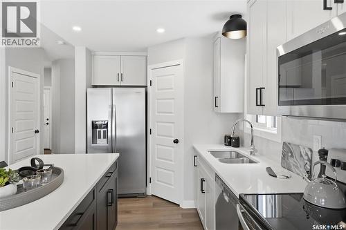 1046 Nightingale Terrace, Saskatoon, SK - Indoor Photo Showing Kitchen With Double Sink With Upgraded Kitchen
