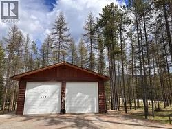 23'4"" x 29'2"" shop with covered wood storage at the back - 