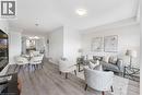 Open-concept living area with light-toned wood-finish flooring, recessed lighting, and white wall finishes - 50 Hollywood Court, Cambridge, ON  - Indoor Photo Showing Living Room 
