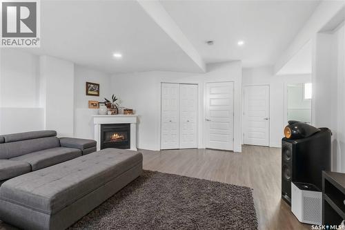 403 Delainey Road, Saskatoon, SK - Indoor Photo Showing Other Room With Fireplace