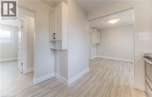 Interior space featuring light wood-finish flooring, white baseboards, and neutral wall paint - 40 Daniel Avenue Unit# 2, Kitchener, ON - Indoor Photo Showing Other Room