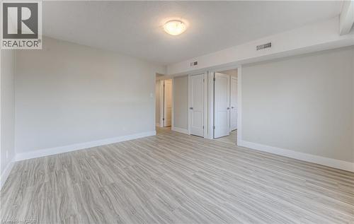 Bright room featuring wood-finish flooring and neutral wall tones - 40 Daniel Avenue Unit# 2, Kitchener, ON - Indoor Photo Showing Other Room