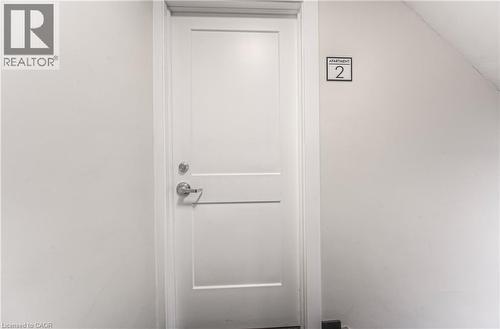 White paneled door with polished chrome hardware - 40 Daniel Avenue Unit# 2, Kitchener, ON - Indoor Photo Showing Other Room