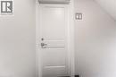 White paneled door with polished chrome hardware - 40 Daniel Avenue Unit# 2, Kitchener, ON  - Indoor Photo Showing Other Room 