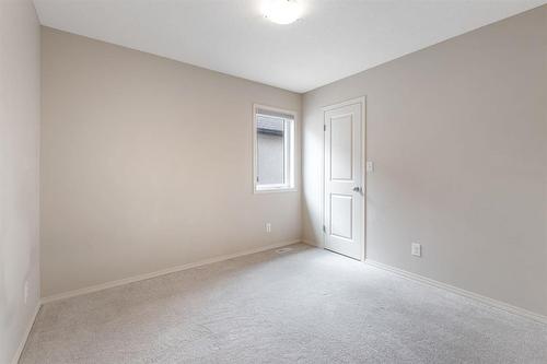 this photo has been virtually staged - 231 Bellflower Road, Winnipeg, MB - Indoor Photo Showing Other Room