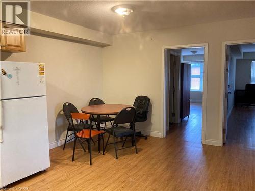 Open concept living area with wood-finish flooring - 392 Albert Street Unit# 302, Waterloo, ON - Indoor