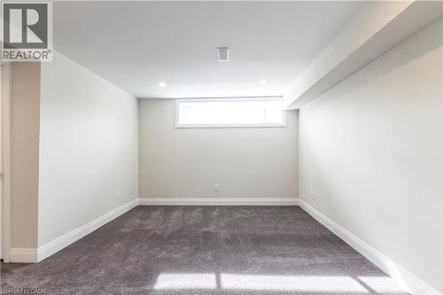 Spacious room featuring gray carpeting, white baseboards, and neutral wall tones - 2337 Barclay Road, Burlington, ON - Indoor Photo Showing Other Room