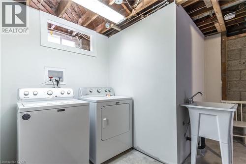 Dedicated laundry area featuring a utility sink and an exposed beam ceiling - 2337 Barclay Road, Burlington, ON - Indoor Photo Showing Laundry Room