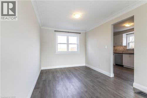 Room featuring wood-finish flooring, white baseboards, and crown molding - 2337 Barclay Road, Burlington, ON - Indoor Photo Showing Other Room