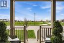 Covered porch with square columns and vertical railings - 42 Yager Drive, Binbrook, ON  - Outdoor With Exterior 