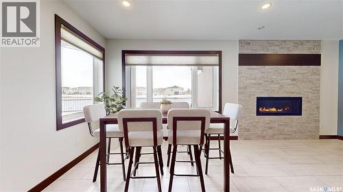 2098 Riverbend View, Regina, SK - Indoor With Fireplace