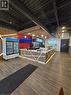 Commercial space featuring a prominent service counter with integrated lighting and a wood-finish facade - 100 Mearns Avenue Unit# 5, Clarington, ON 