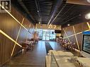 Commercial interior featuring wood-finish wall panels with integrated linear lighting - 100 Mearns Avenue Unit# 5, Clarington, ON 