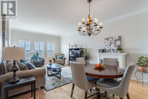 403 - 1499 Nottinghill Gate, Oakville, ON - Indoor Photo Showing Dining Room With Fireplace