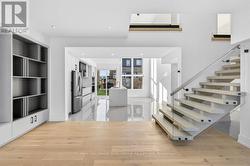 quartz waterfall island, sleek cabinetry - 